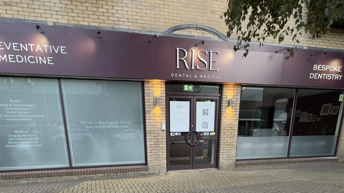 Completed Chelmsford commercial frontage with burgundy doors and frames by ProFinish